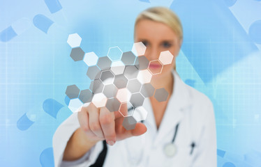 Doctor using touchscreen displaying chemical formula