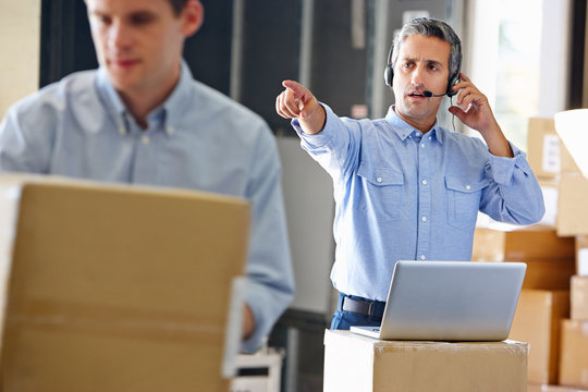 Manager Using Headset In Distribution Warehouse