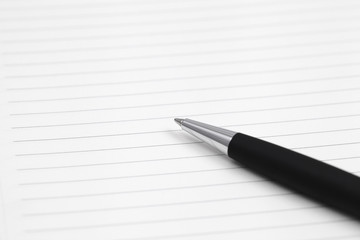 Naklejka premium pen on note book