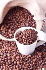 cup of coffee on a background coffee beans 