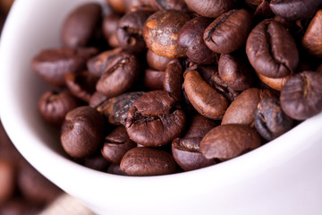 cup of coffee on a background coffee beans 