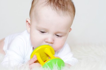 The baby with a rattle