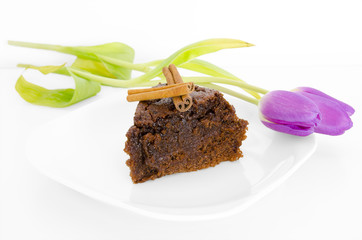 Chocolate cake with cinnamon and tulips