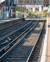 Fototapeta na wymiar Rail tracks in bright summer day