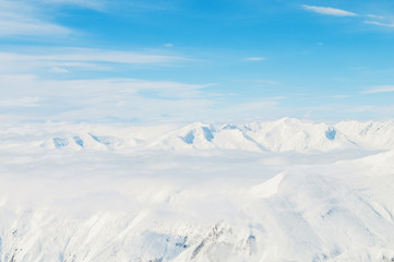 Snow mountains on bright winter day