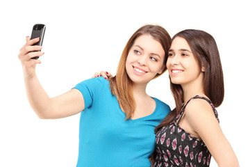 Obraz na płótnie Canvas Dwa szczęśliwy nastolatki fotografowanie siebie o współczynniku pH komórek