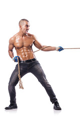 Fototapeta premium Muscular man pulling the rope