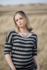 Fototapeta premium Young Woman with Beautiful Blue Eyes