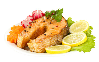 Appetizing grilled salmon with lemon and vegetables isolated