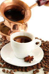 Cup and pot of coffee and coffee beans, isolated on white