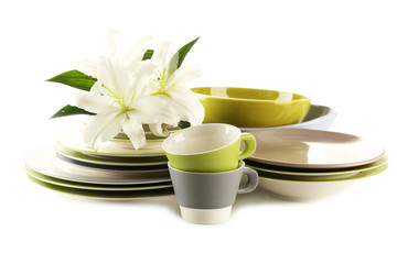 Empty bowls, plates and cups isolated on white
