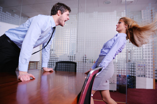 Angry busines sman screaming at employee