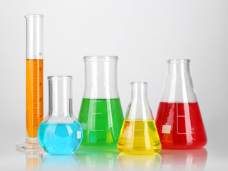 Test tubes with colorful liquids isolated on white