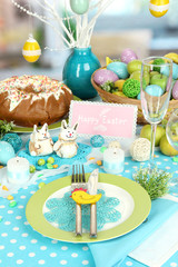 Serving Easter table on room background