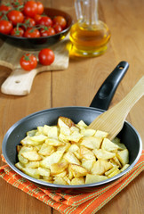 Roast potatoes in a frying pan