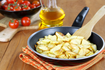 Roast potatoes in a frying pan