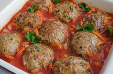 Meatballs with herbs and tomato sauce in the pan