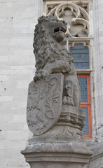 Lion with coat of arms of Bruges. Grote Markt square, Bruges, Be