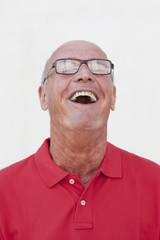 happy senior man laughing out loud