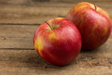 Red apples on a wooden table