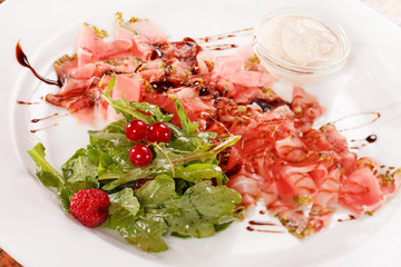 Prosciutto ham with salad