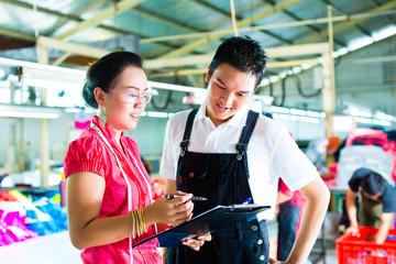 Production manager and designer in a factory