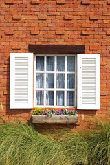 Vintage white window on brick wall