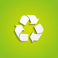 Recycling symbol on green background