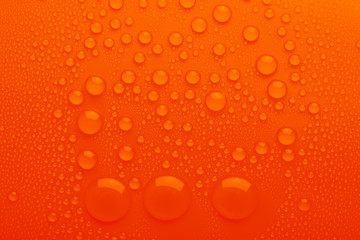 Water drops on orange background