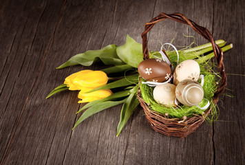 Easter still life with eggs in basket