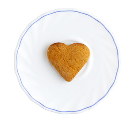 heart shaped cookie on plate isolated on white
