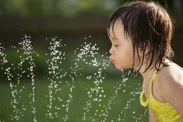 Child drinking from the water fountain - 49689357