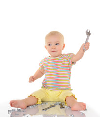 baby with tools on white background