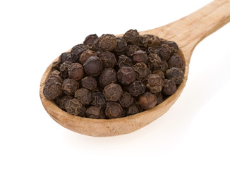 pepper spices in spoon on white