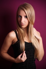 Fototapeta premium beautiful blond woman with violet background