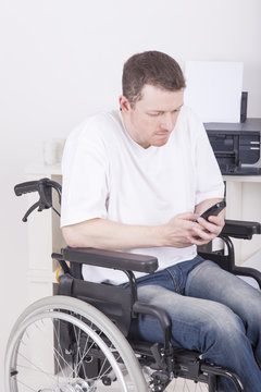 office worker in wheelchair having a phone call