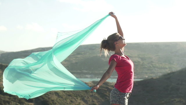 Woman with pareo outdoors, super slow motion, shot at 240fps