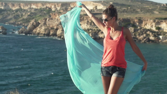 Woman with pareo outdoors, super slow motion