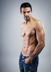 A handsome male model posing at a studio.