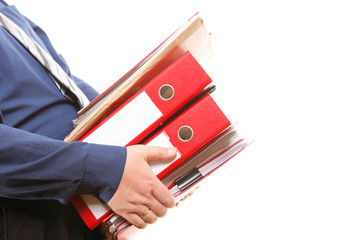 Male office worker carrying a stack of files