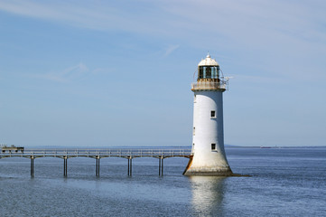 Fototapeta na wymiar White lighthouse in the river Shannon