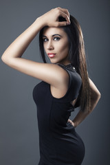 Fototapeta premium Beautiful woman wearing black dress