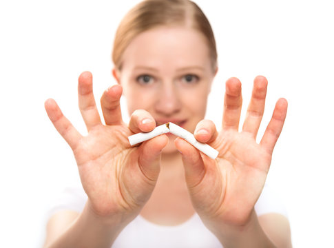 woman breaking cigarette. concept stop smoking