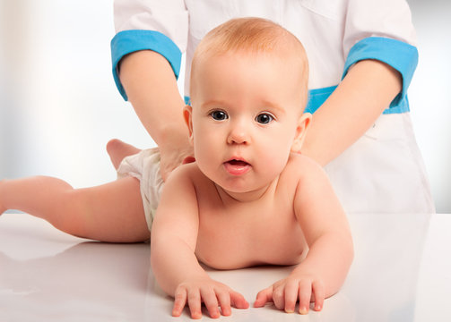 Doctor Holds Baby Massage Therapy