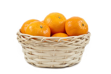 Tangerines (mandarin)  in a straw cup