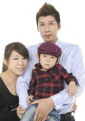 portrait of a asian young man standing with his wife and child