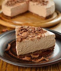 Cold chocolate cheesecake on brown plate