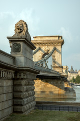 Guardian lion statue on famous Chain Bridge in  Budapest