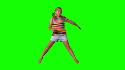 Girl jumping with limbs outstretched on green screen - Powered by Adobe