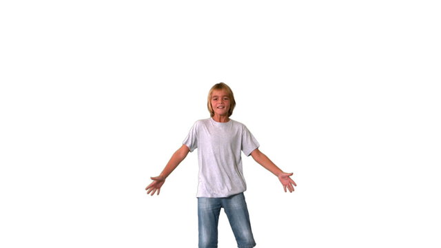Boy jumping up and down on white background